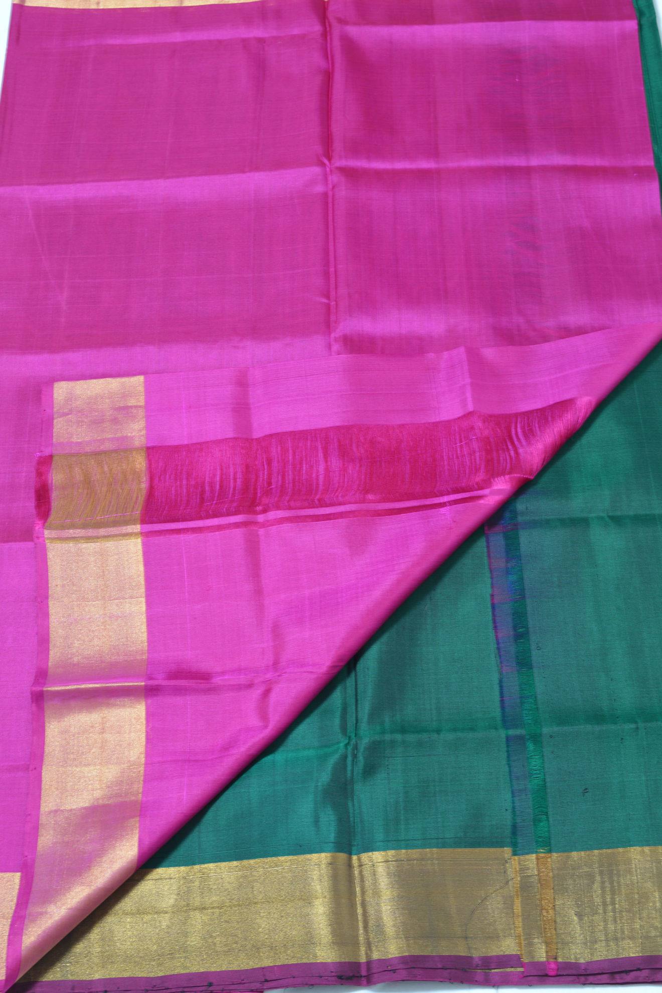 Tvis and Bliss. Dark Green and Pink Uppada Silk Saree